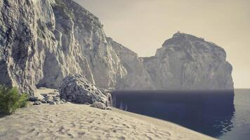 CGI Coastal cliffs meet serene waters in a tranquil beach setting at midday video