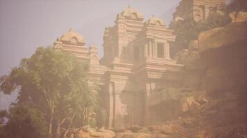 CGI Ancient temple ruins surrounded by lush greenery during hazy daylight video