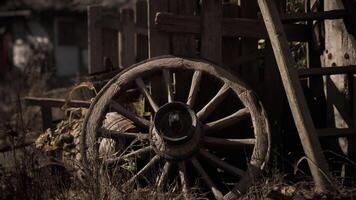 CGI Rustic wooden wheel in a weathered farm setting during golden hour video