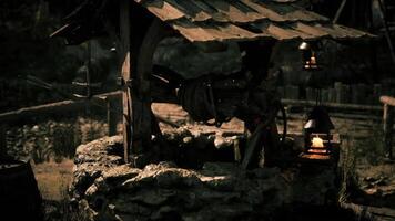 CGI Rustic water well with wooden structure in a serene countryside at dusk video