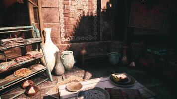 CGI Vibrant pottery and decor displayed in a sunlit marketplace setting video
