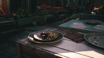 CGI Fruits resting on a decorated table at a bustling market in late afternoon video
