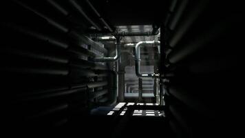 CGI View of industrial pipes in a dark, confined space with light filtering through video