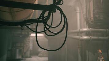 CGI Industrial setting with hanging ropes and pipes in a dim light atmosphere video