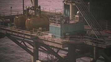 CGI Oil rig equipment and structures against coastal backdrop at dusk video