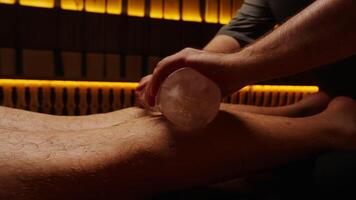 Massaging Gastrocnemius Muscles By Ice In Sauna, Closeup View, Enjoy Lazy Day In Health Center video