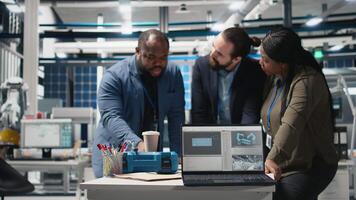African American engineers doing teamwork on production line for solar panels production, combining technical insight and teamwork for clean energy infrastructure. Sustainability. Camera B. video