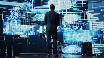 Professional leader looking around at AI neural networks system, employing digital brain visualization for machine learning and programming. Smart technology and algorithmic thinking. Camera B. video
