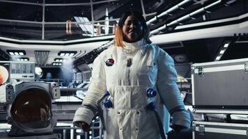 Joyous astronaut greeting command center researchers during videocall, presenting analysis findings. Smiling orbit station crew member provides scientific findings to Earth team, camera A video