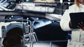 Female astronaut using tablet to check space station analytics after completing surface mission on unfamiliar planet. Woman inputting navigation coordinates, preparing for return to Earth, camera B video