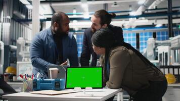 Diverse team members overseeing factory activity next to copy space, blending professionalism and technical expertise in the world of sustainable industrial energy. Cheaper power. Camera B. video