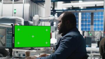 Black man specialist checks solar panel production with copy space, reviewing a checklist during inspection for the vital role in alternative energy production. Tech infrastructure. Camera A. video