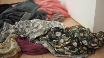 Clothes scattered across the bedroom floor in disarray video