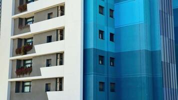This stylish urban building showcases a striking and unique combination of vibrant colors alongside modern architecture photo