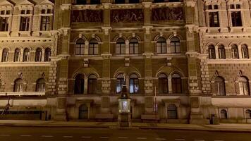 A beautifully illuminated historic building elegantly showcasing its intricate architectural details at night photo