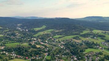 This is a breathtaking aerial landscape that showcases an array of lush green hills alongside serene countryside views photo