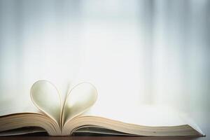 Open Book with Heart Shaped Pages, Symbolizing Romance and the Love of Reading photo