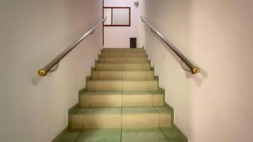 A serene view of a lovely staircase with stylish handrails invites exploration and encourages upward movement photo