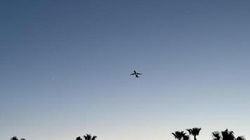 An airplane skillfully navigates the bright blue sky, showcasing the wonders of modern aviation technology photo