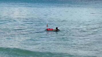 A skilled diver explores vibrant ocean depths with a safety buoy, showcasing a thrilling underwater adventure photo