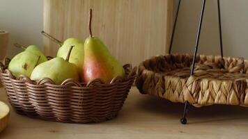 Fresh fruit display in a woven basket on a wooden table video