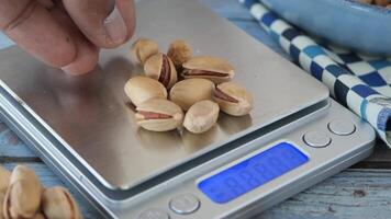 Measuring pistachios on a kitchen scale video