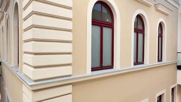 Sophisticated and elegant modern architecture showcases magnificent arched windows alongside beautifully textured walls photo