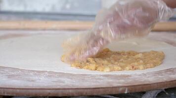 Preparing dough for traditional flatbread in a local kitchen video
