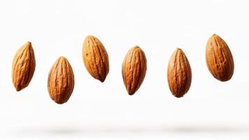 Simple isolated almonds nuts levitating on white background. Image for for food, nutrition, or ingredient concepts. Useful for healthy eating, snack, or nut-related content. photo