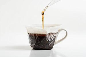 Brewing Tea Into A White Mug Using A Filter photo