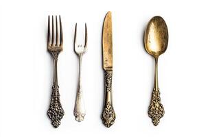 Antique Ornate Silverware Set Displayed Against White Background photo