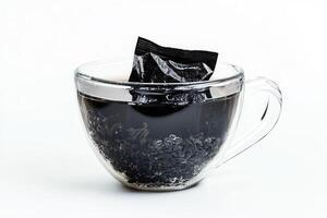 Black Tea Steeped In A Glass Mug photo