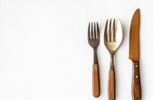 Rustic Wooden Handled Cutlery Set on White photo