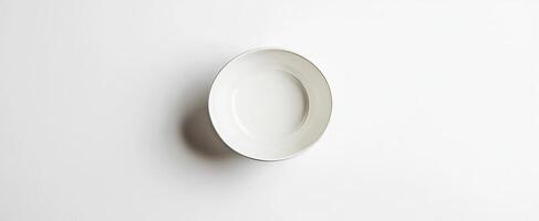 Empty White Oval Serving Bowl on White Background photo