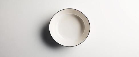 An empty oval ceramic bowl on a white background photo