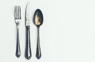 Antique silverware set on a white background photo