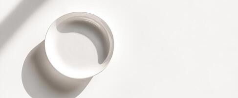 White ceramic bowl on a white background with shadow photo
