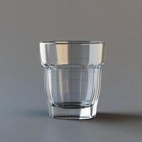 A Clear Glass Tumbler on a Gray Surface photo