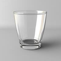 A Clear Empty Glass on a Grey Background photo