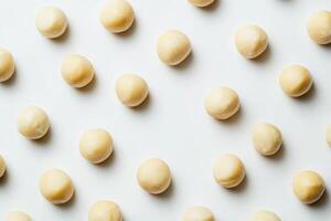 Macadamia nuts arranged in a repeating pattern photo