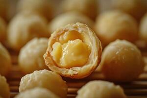 Golden Pastry Balls Filled With Creamy Custard photo