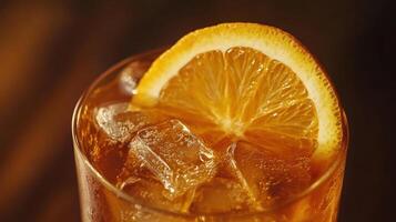 Iced Tea Drink Garnished With Orange Slice photo