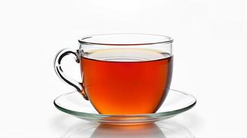 A transparent glass cup with brewed tea sits on a matching saucer, isolated on a white background. The image is suitable for illustrating beverage, refreshment, or tea-related concepts. photo
