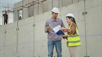 Engineers and architecture inspect and supervise the construction of building walls,95 photo