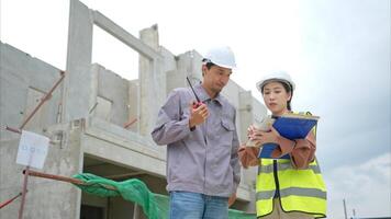 Engineers and architecture inspect and supervise the construction of building walls,83 photo