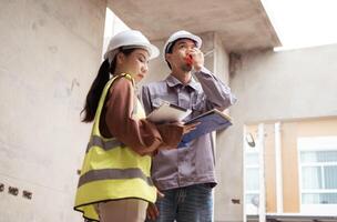Engineers and architecture inspect and supervise the construction of building walls,69 photo