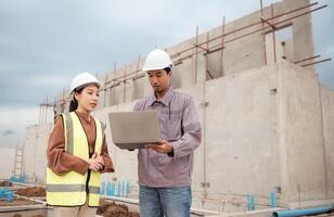 Engineers and architecture inspect and supervise the construction of building walls,65 photo