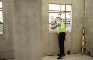 Engineers construction projects inspect and supervise the construction of building walls,38 photo