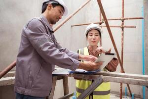 Engineers and architecture inspect and supervise the construction of building walls,28 photo