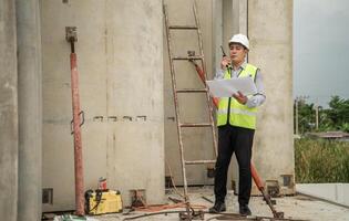 Engineers construction projects inspect and supervise the construction of building walls,13 photo